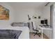 Bright bedroom featuring a desk setup with dual monitors and natural light at 9157 Acclamation Ct, Las Vegas, NV 89149