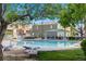 Inviting community pool with ample seating and shade, perfect for relaxing and socializing at 9157 Acclamation Ct, Las Vegas, NV 89149
