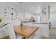 Dining area with wood table, seating for four, and a view into the kitchen at 9157 Acclamation Ct, Las Vegas, NV 89149
