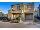 Charming two-story home featuring a small front yard and balcony at 9157 Acclamation Ct, Las Vegas, NV 89149