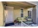 Inviting covered front porch with seating area, great curb appeal at 9157 Acclamation Ct, Las Vegas, NV 89149