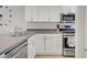 Modern kitchen featuring stainless steel appliances and white cabinets at 9157 Acclamation Ct, Las Vegas, NV 89149