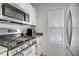 Well-equipped kitchen with stainless steel gas range and appliances at 9157 Acclamation Ct, Las Vegas, NV 89149