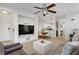 Bright living area with open floor plan to dining and kitchen, perfect for entertaining at 9157 Acclamation Ct, Las Vegas, NV 89149