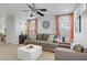 Inviting living room with a cozy gray sofa and matching armchair seating at 9157 Acclamation Ct, Las Vegas, NV 89149