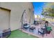 Outdoor patio complete with seating, greenery, and a shade umbrella at 9157 Acclamation Ct, Las Vegas, NV 89149