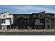 Contemporary townhome featuring a modern architectural design with multi-tone color palette and clean lines at 9233 Hudson Yards Ct, Las Vegas, NV 89148