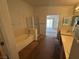 Bright bathroom featuring a bathtub, glass shower, and double sink vanity at 96 Saint Johns Wood Ave, Henderson, NV 89002