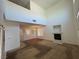 Open living room with high ceilings, fireplace, and view into dining area, ready for personalization at 96 Saint Johns Wood Ave, Henderson, NV 89002