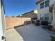 Spacious concrete backyard featuring a grill and chairs, ideal for outdoor gatherings at 9628 Scrub Jay Ct, Las Vegas, NV 89148