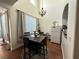 Charming dining area boasts tall ceilings and a decorative chandelier at 9628 Scrub Jay Ct, Las Vegas, NV 89148