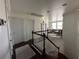 The second floor hallway features hardwood floors and lots of natural light at 9628 Scrub Jay Ct, Las Vegas, NV 89148