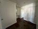 Upstairs hallway with wood floors, neutral paint and doors leading to the bedrooms at 9628 Scrub Jay Ct, Las Vegas, NV 89148