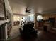 The open floor plan features hardwood floors and seamlessly connects the living room and kitchen at 9628 Scrub Jay Ct, Las Vegas, NV 89148