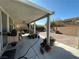 Inviting covered patio showcases a brick-paved outdoor space, perfect for dining or relaxation at 9628 Scrub Jay Ct, Las Vegas, NV 89148