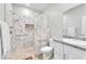 Bathroom featuring marble shower with pebble floor and granite vanity at 10266 Sweet Holly Pl, Las Vegas, NV 89149