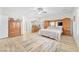 Bright bedroom with hardwood flooring, ceiling fan and a king bed at 10266 Sweet Holly Pl, Las Vegas, NV 89149