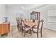 Charming dining room featuring a wooden table, hutch, and seating for ten at 10266 Sweet Holly Pl, Las Vegas, NV 89149