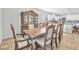 Elegant dining room with an ornate wooden table, hutch, and stylish chairs at 10266 Sweet Holly Pl, Las Vegas, NV 89149