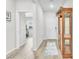 Welcoming entryway with wood-look floors, a glass cabinet, and an open view to exercise equipment at 10266 Sweet Holly Pl, Las Vegas, NV 89149