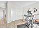 Bright exercise room features wood floors, large closet and an exercise machine at 10266 Sweet Holly Pl, Las Vegas, NV 89149