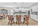Open-concept kitchen featuring a breakfast bar, stainless steel appliances, and ample counter space at 10266 Sweet Holly Pl, Las Vegas, NV 89149