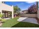 Private backyard featuring low-maintenance artificial turf and a concrete patio at 10729 Grey Havens Ct, Las Vegas, NV 89135