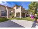 Expansive backyard with a covered patio, artificial turf, and mature landscaping at 10729 Grey Havens Ct, Las Vegas, NV 89135