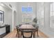 Elegant dining room with high ceilings, ample natural light, and stylish pendant lighting at 10729 Grey Havens Ct, Las Vegas, NV 89135