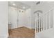 Bright entryway with double doors, staircase, and hardwood floors, creating a welcoming entrance at 10729 Grey Havens Ct, Las Vegas, NV 89135