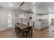 Open concept kitchen with dining area, marble countertops, stainless steel appliances, and ample cabinetry at 10729 Grey Havens Ct, Las Vegas, NV 89135