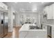 Spacious kitchen with stainless steel appliances, marble countertops, and a dining area at 10729 Grey Havens Ct, Las Vegas, NV 89135