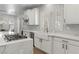 Modern kitchen with a large marble countertop, stainless appliances, and white cabinets at 10729 Grey Havens Ct, Las Vegas, NV 89135