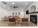 Comfortable living room featuring a plush sectional, modern decor, and a cozy fireplace at 10729 Grey Havens Ct, Las Vegas, NV 89135