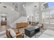 Open-concept living room with lots of natural light and a staircase leading to the second floor at 10729 Grey Havens Ct, Las Vegas, NV 89135