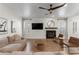 Bright living room with modern decor, fireplace, and wood floors, offering a stylish and inviting atmosphere at 10729 Grey Havens Ct, Las Vegas, NV 89135
