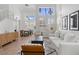 Spacious living room with high ceilings, bright light, and an adjacent dining area at 10729 Grey Havens Ct, Las Vegas, NV 89135