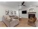 Inviting living room with modern fireplace, comfortable seating, and contemporary artwork at 10729 Grey Havens Ct, Las Vegas, NV 89135