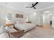 Serene main bedroom with a sitting area, tray ceiling, and ensuite bathroom access at 10729 Grey Havens Ct, Las Vegas, NV 89135