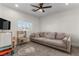 Bright playroom with a large couch, television, and a play kitchen for  at 10729 Grey Havens Ct, Las Vegas, NV 89135