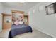 Spare bedroom features a murphy bed, custom built-ins, and tile flooring at 1116 Piazza Telle, Henderson, NV 89052