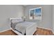 Bright bedroom with hardwood floors, a large window, and a white sleigh bed at 1116 Piazza Telle, Henderson, NV 89052