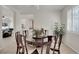 Elegant dining room with a round table, eight chairs, and plantation shutters at 1116 Piazza Telle, Henderson, NV 89052