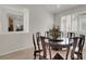Formal dining room featuring a decorative table, seating for eight, and bright shutters at 1116 Piazza Telle, Henderson, NV 89052