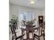 Elegant dining room with a decorative table and chairs, set in front of shuttered windows at 1116 Piazza Telle, Henderson, NV 89052