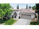 Charming single-story home featuring a tile roof, manicured lawn, and a two-car garage at 1116 Piazza Telle, Henderson, NV 89052