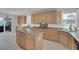 Spacious kitchen with granite counters, light wood cabinets, and stainless steel appliances at 1116 Piazza Telle, Henderson, NV 89052
