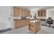 Bright kitchen with granite countertops, a center island, and modern appliances at 1116 Piazza Telle, Henderson, NV 89052