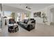 Open living area featuring tile flooring, a fireplace, ample natural light, and backyard access at 1116 Piazza Telle, Henderson, NV 89052