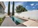 Private pool area with a sleek pool, modern design, and landscaping at 1116 Piazza Telle, Henderson, NV 89052